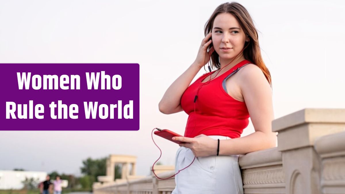 Teenager girl standing in the park listening to the music and chatting on her phone at sunset.