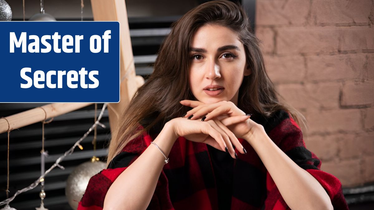 Young woman model posing with checkered plaid near Christmas balls.