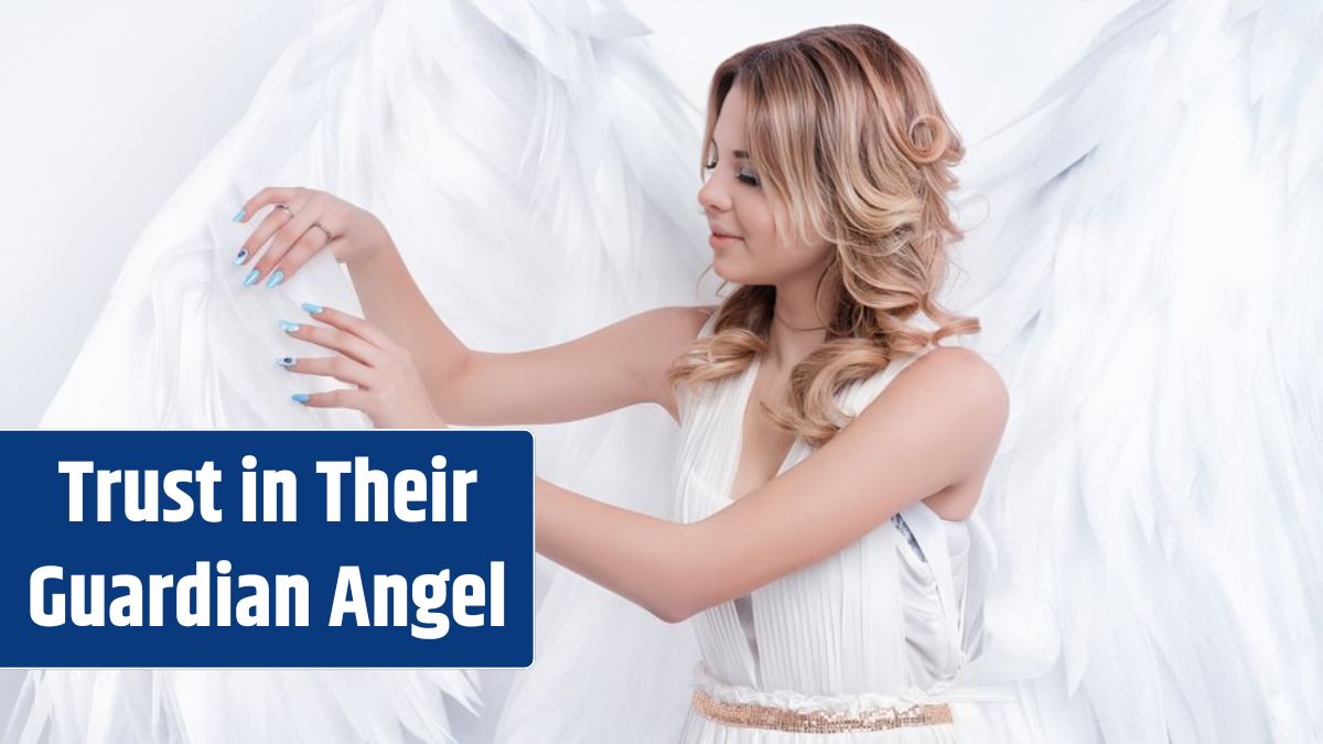 Beautiful young model with big angel wings posing in the studio.