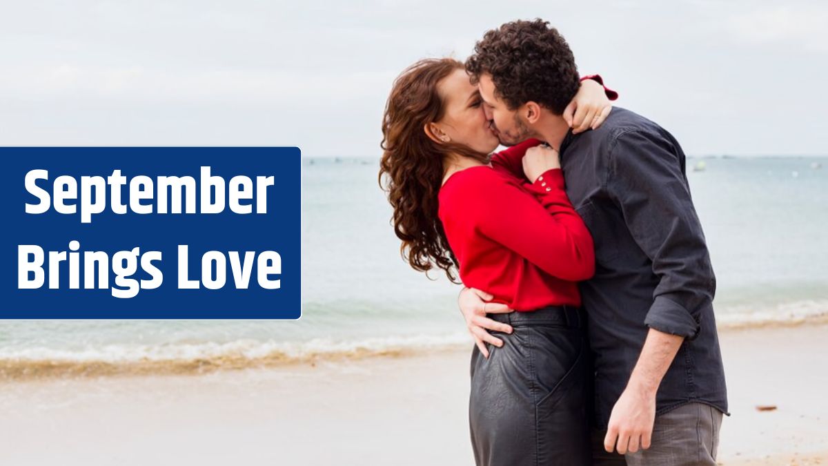 Young couple kissing on sea shore.