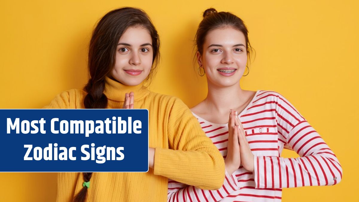 Two young girls wearing casual shirts posing with palms together and smiling.