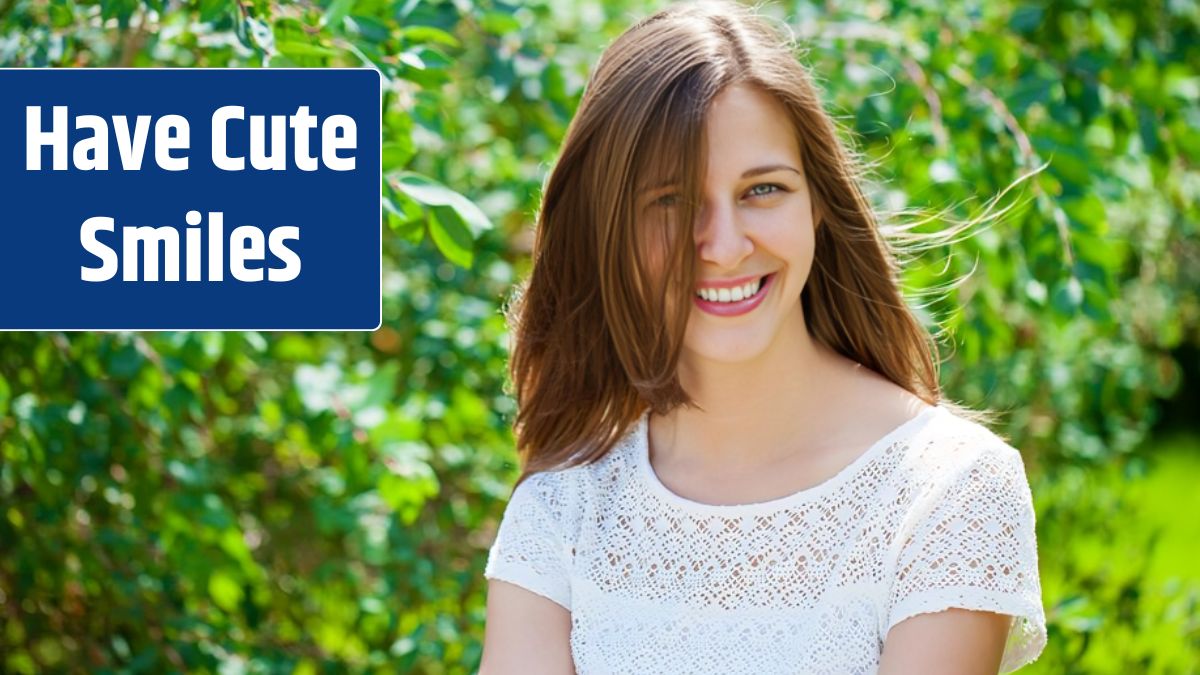 Close up portrait of beautiful young happy brunette woman with fresh and clean skin summer street outdoors.