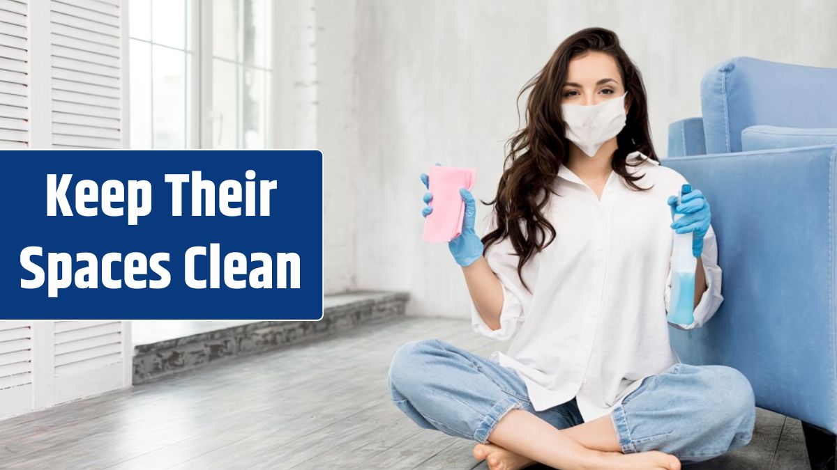 Front view of woman with face mask holding cleaning solution.