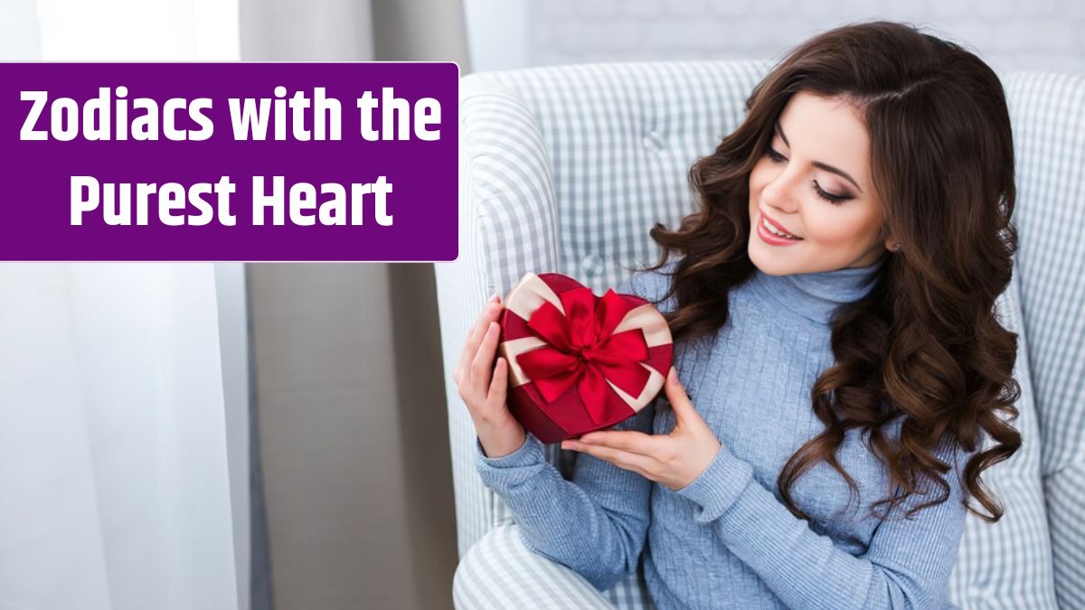 Smiling happy woman with gift box shape heart in home.